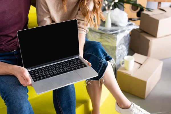 Cropped View Couple Holding Laptop Blank Screen While Sitting Stairs — Stock Photo, Image