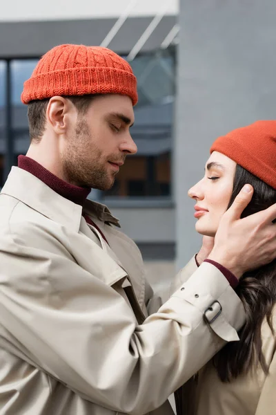 Side View Trendy Man Touching Young Woman Beanie Hat — Stock Photo, Image