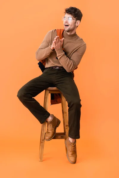 Stylish Man Autumn Outfit Glasses Sitting Praying Hands Wooden Stool — Stock Photo, Image