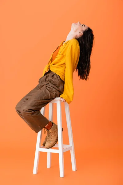 Trendy Woman Autumn Outfit Sitting White Stool Looking Orange — Stock Photo, Image