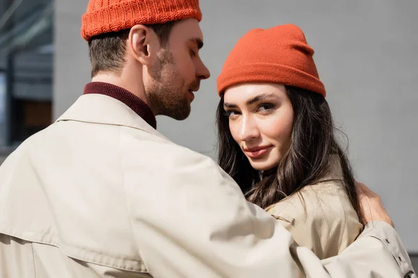 Stylish Man Trench Coat Hugging Woman Beanie Hat — Stock Photo, Image