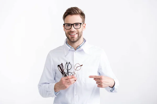 Front View Smiling Ophthalmologist Holding Pointing Several Eyeglasses While Looking — Stock Photo, Image