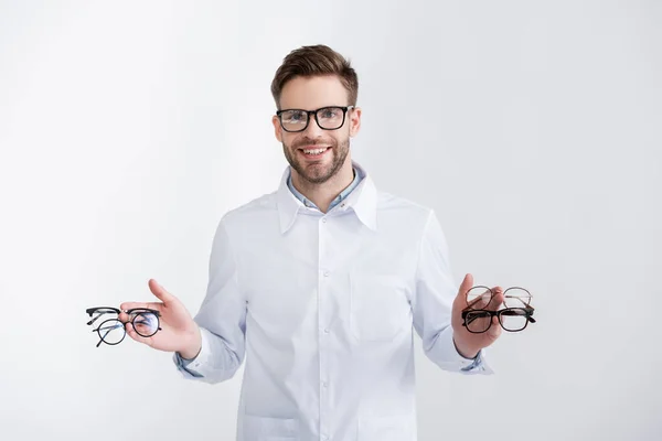 Front View Smiling Ophthalmologist Showing Pairs Eyeglasses Fingertips While Looking — Stock Photo, Image