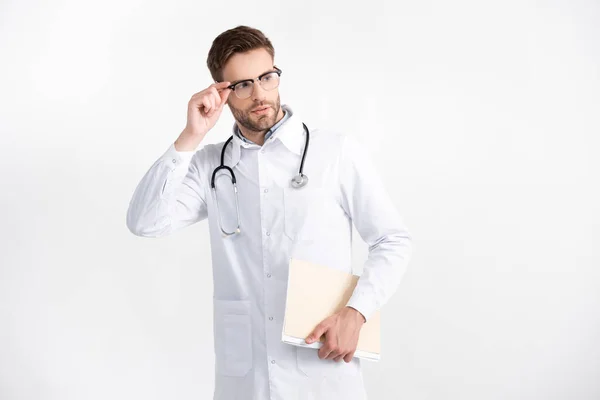 Young Adult Doctor Folder Holding Eyeglasses Frame While Looking Away — Stock Photo, Image