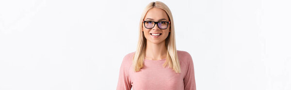 Portrait of happy blonde woman with eyeglasses looking at camera isolated on white, banner