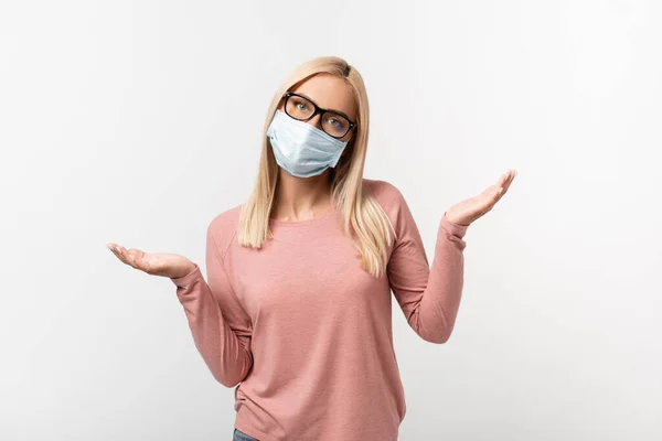 Blonde Woman Medical Mask Eyeglasses Showing Confused Sign Isolated Grey — Stock Photo, Image