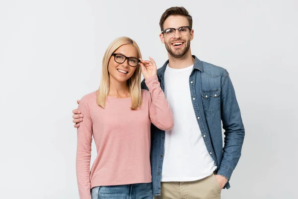 Smiling Man Eyeglasses Embracing Girlfriend Isolated Grey — Stock Photo, Image