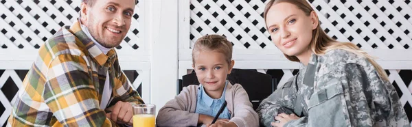 Smiling Girl Holding Pen Sitting Man Checkered Shirt Woman Military — Stock Photo, Image