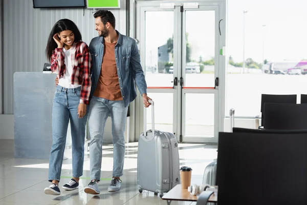 Cheerful Multicultural Couple Luggage Walking Airport — Stock Photo, Image