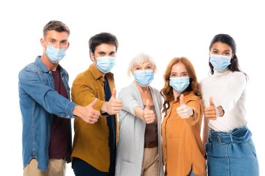 Multicultural friends showing like while wearing medical masks isolated on white clipart
