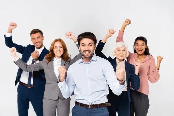 Positive Businessman Showing Yeah Gesture Multiethnic Colleagues Blurred Background Isolated — Stock Photo, Image