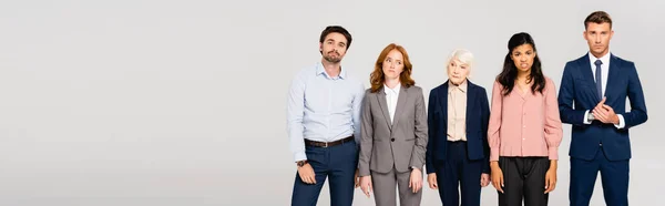 Pensive Businesspeople Looking Camera While Standing Isolated Grey Banner — Foto de Stock