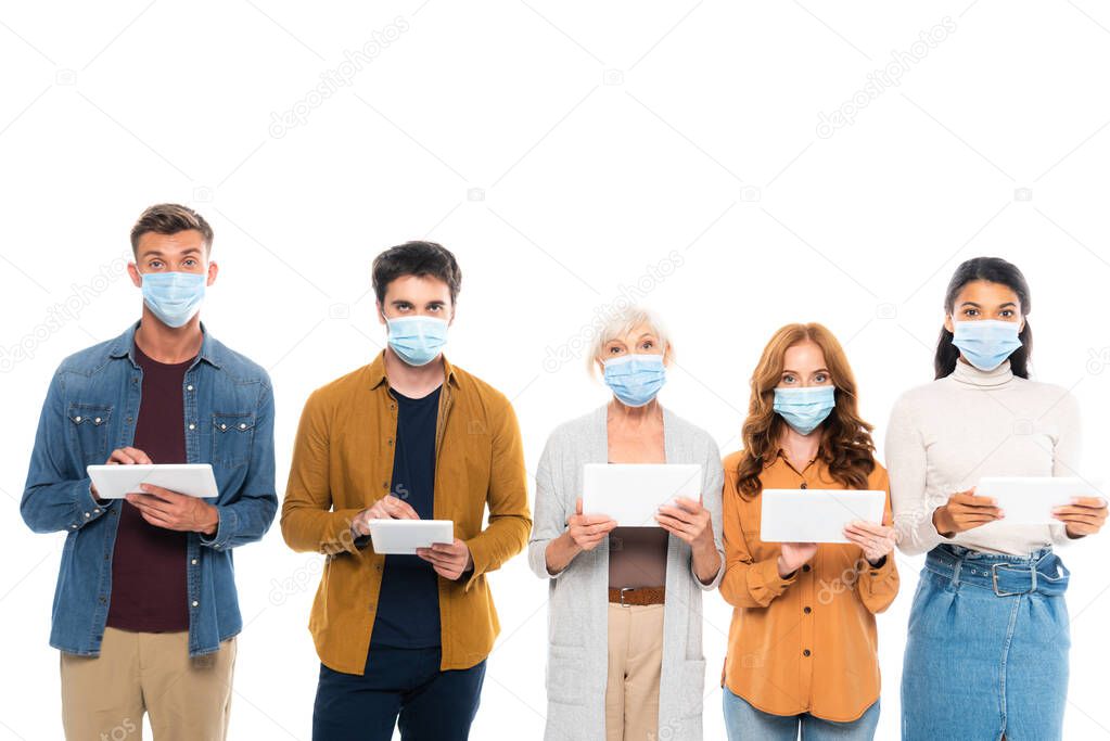 Multicultural people wearing medical masks and using digital tablets isolated on white