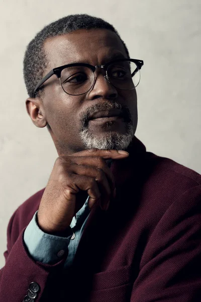 Portrait of thoughtful african american man in trendy eyeglasses — Stock Photo