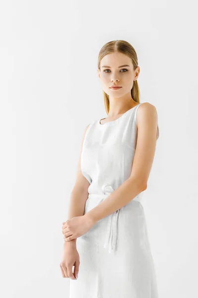 Young attractive woman in linen white dress posing isolated on grey background — Stock Photo