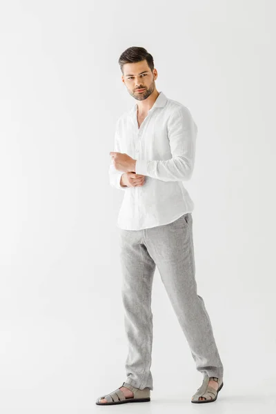 Handsome man in linen clothes posing isolated on grey background — Stock Photo