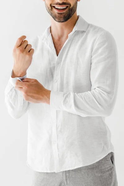 Cropped image of smiling man in linen white shirt isolated on grey background — Stock Photo