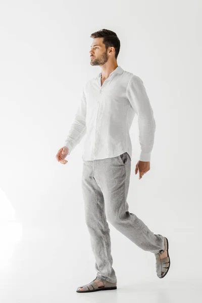 Side view of handsome man in linen clothes posing isolated on grey background — Stock Photo