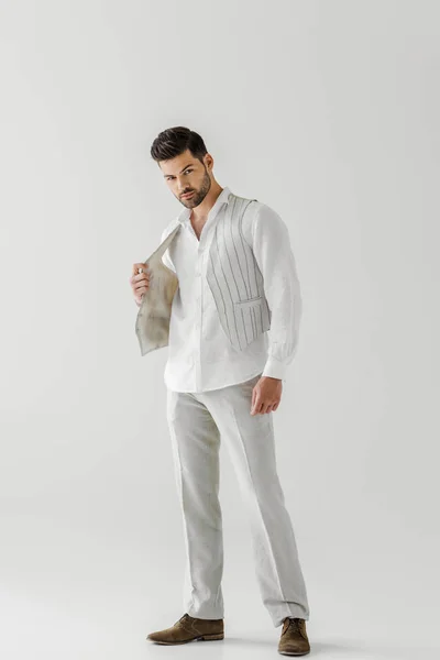 Handsome man in linen clothes posing isolated on grey background — Stock Photo