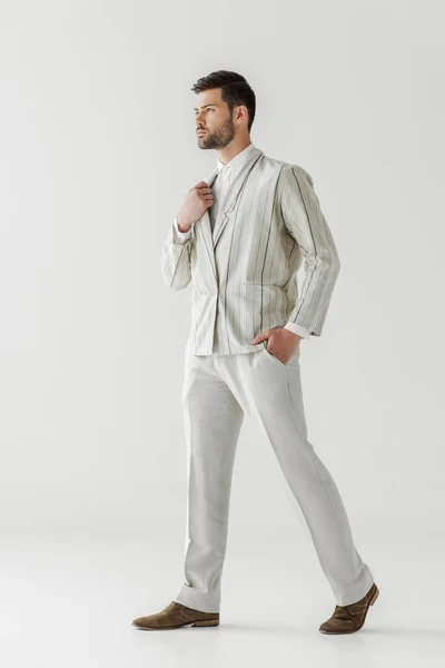 Serious young man in vintage stylish suit on white — Stock Photo