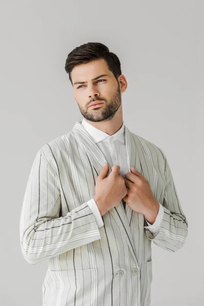 Jovem bonito em jaqueta listrada vintage em branco — Fotografia de Stock