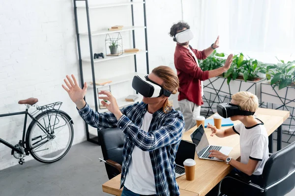 High angle view of young start up team using virtual reality headsets at workplace — Stock Photo