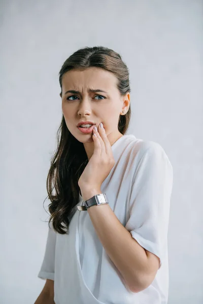 Attractive young woman suffering from tooth pain — Stock Photo