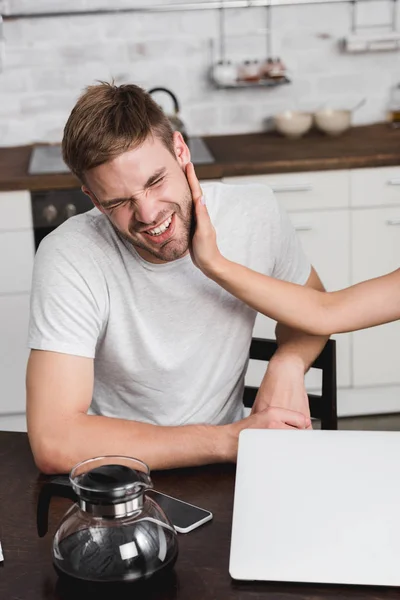Cropped shot of young woman slapping boyfriend during quarrel at home — Stock Photo