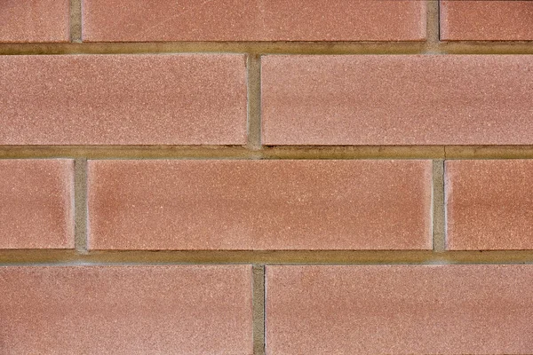 Texture rugueuse de mur de brique rouge, fond plein cadre — Photo de stock