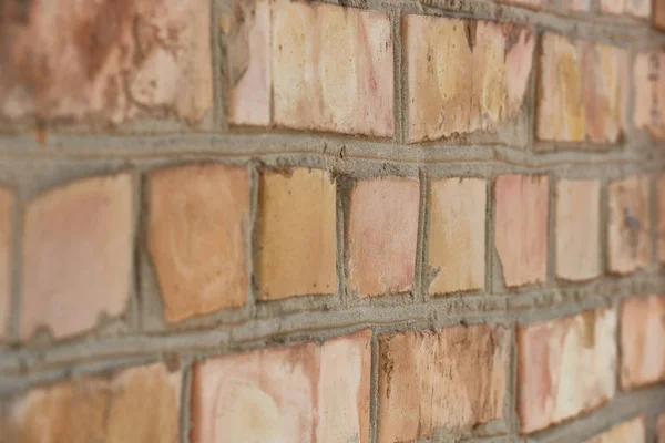 Close-up view of old weathered brick wall textured background — Stock Photo