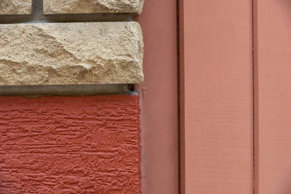 Close-up view of bricks, red wall and wooden planks background — Stock Photo