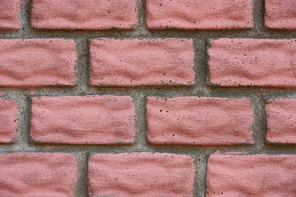 Close-up view of old red weathered brick wall, textured background — Stock Photo