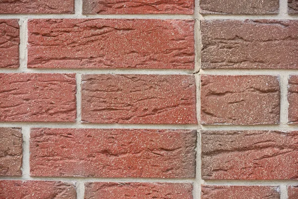 Vista cornice completa di muro di mattoni rosso intemperie, sfondo strutturato — Foto stock