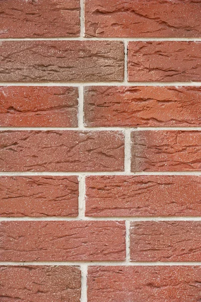 Close-up view of red weathered brick wall, textured background — Stock Photo