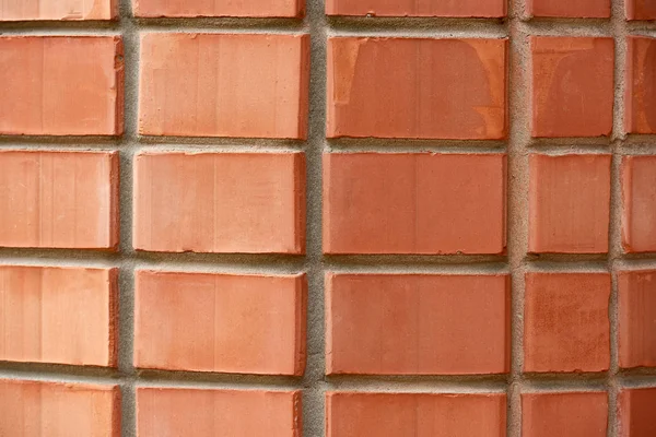 Full frame view of red weathered brick wall textured background — Stock Photo
