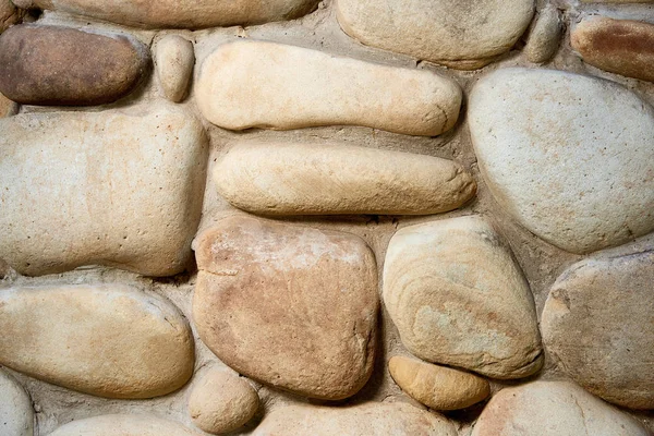 Close-up view of rough weathered stone wall texture, full frame background — Stock Photo