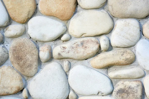 Vista de cerca de la pared de piedra clara fondo texturizado - foto de stock