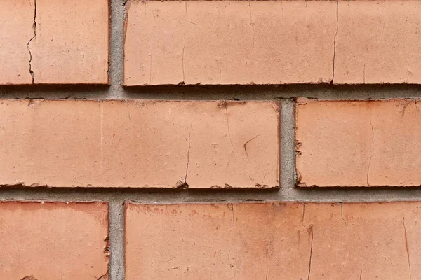 Vista de cerca del fondo texturizado de la pared de ladrillo rojo - foto de stock