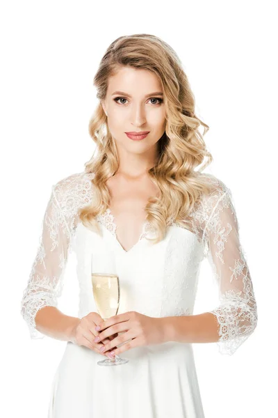 Happy young bride with glass of champagne looking at camera isolated on white — Stock Photo