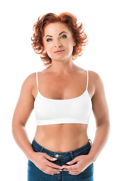 Middle aged woman in bra looking at camera isolated on white — Stock Photo