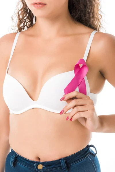 Cropped shot of young woman in bra holding pink ribbon, breast cancer awareness concept — Stock Photo