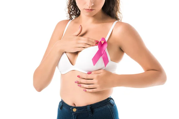 Cropped shot of woman in bra with pink ribbon checking breast, cancer awareness concept — Stock Photo