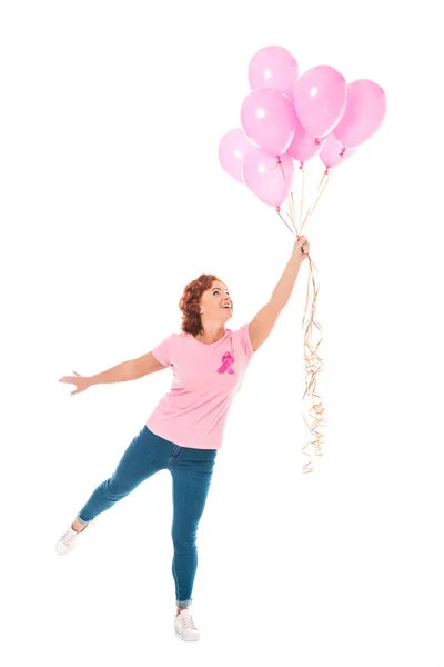 Веселая женщина с кучей розовых шариков, изолированных на белом, рак груди концепции — стоковое фото