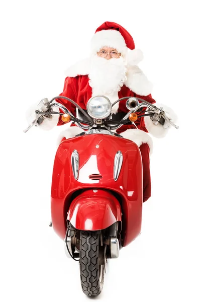 Santa claus riding vintage scooter and looking at camera isolated on white — Stock Photo