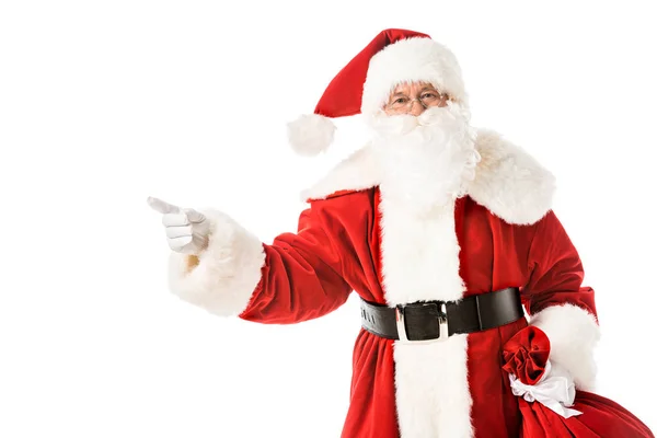 Santa claus pointing away while looking at camera isolated on white — Stock Photo