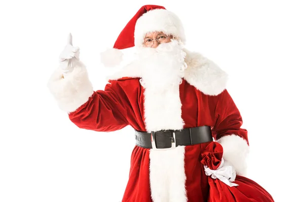 Babbo Natale punta verso l'alto mentre guarda la fotocamera isolata su bianco — Foto stock
