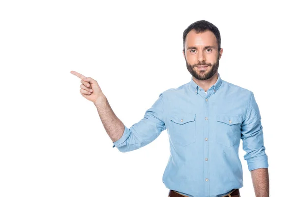 Uomo barbuto che punta su qualcosa di isolato sul bianco — Foto stock