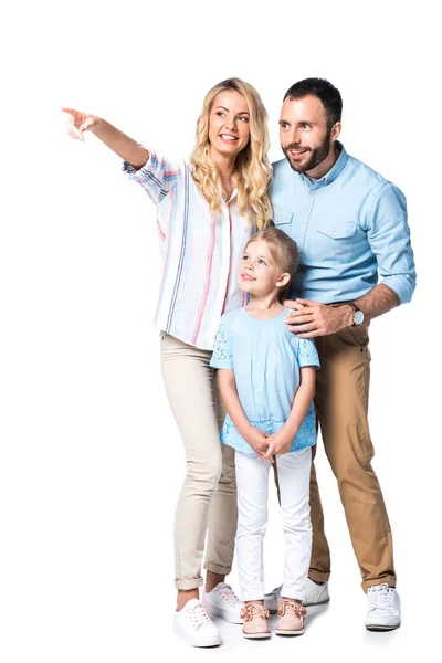 Família feliz com a mãe mostrando em algo isolado no branco — Fotografia de Stock