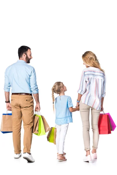 Back view of family with shopping bags isolated on white — Stock Photo
