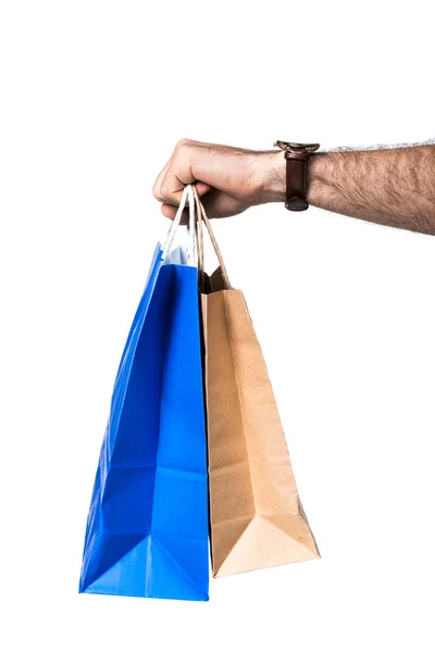 Uomo vista ritagliata tenendo borse della spesa isolato su bianco — Foto stock